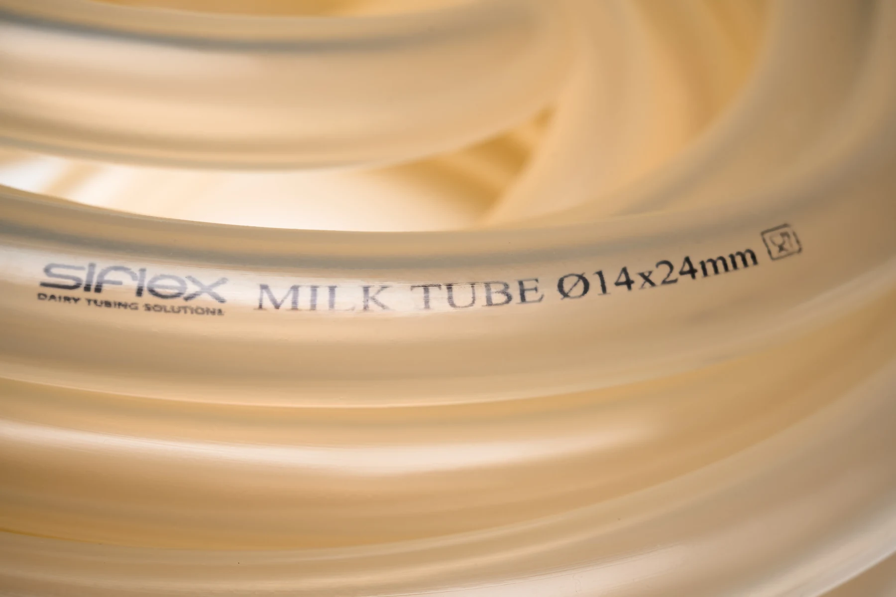 Close-up of SiFlex milk tubing marked 14 by 24 mm